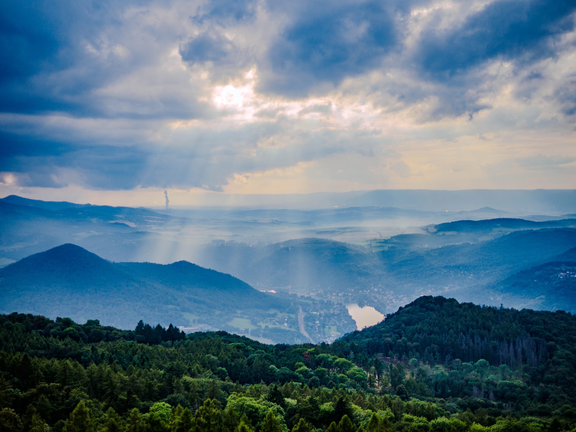 A mountainous landscape under a cloud-filled sky, Czech Republic, f/1.4, 25mm