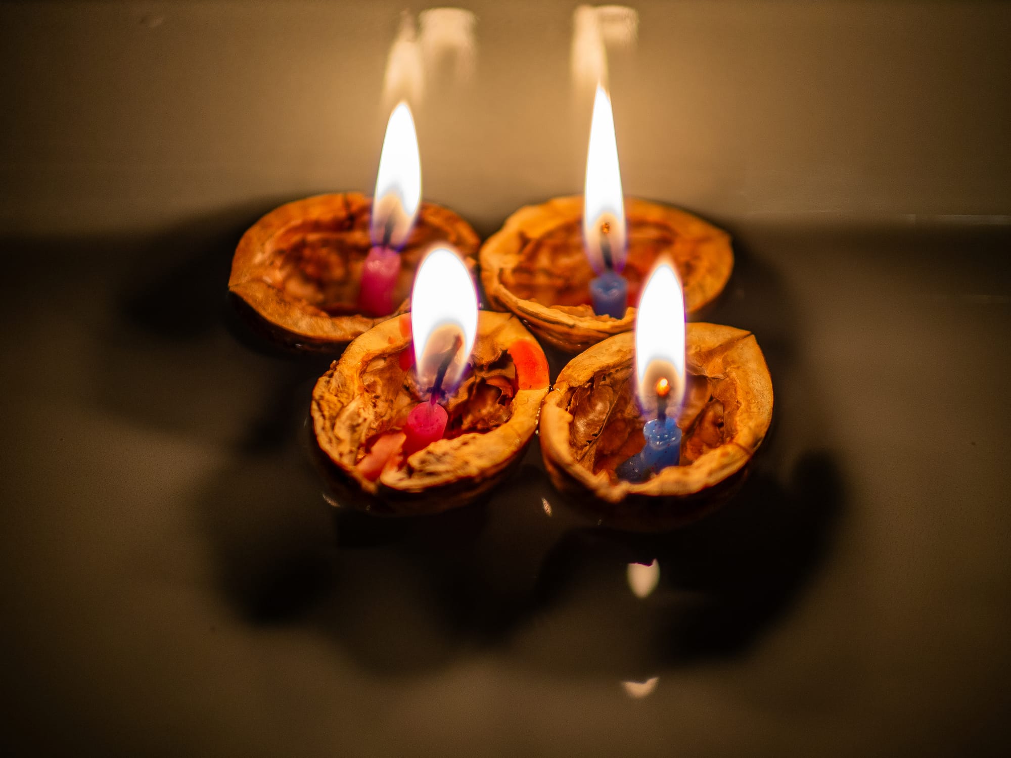 A Czech Advent tradition of floating walnut shell candles on water.